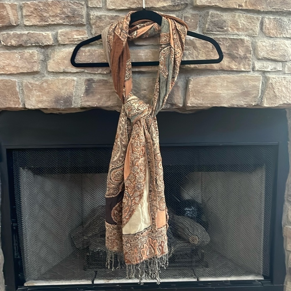 Autumn colored scarf with a mixture of browns and orange with fringe